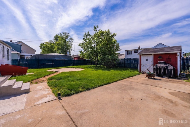 86 Lawrence St, Fords, NJ 08863 - fenced backyard featuring a storage shed and a patio area