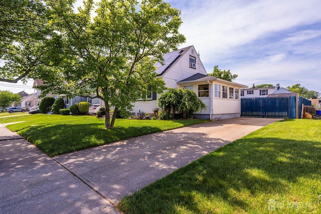 86 Lawrence St, Fords, NJ 08863 - view of front of property featuring concrete driveway and roof mounted solar panels