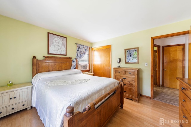 86 Lawrence St, Fords, NJ 08863 - bedroom with light wood-style flooring, a closet, and cooling unit