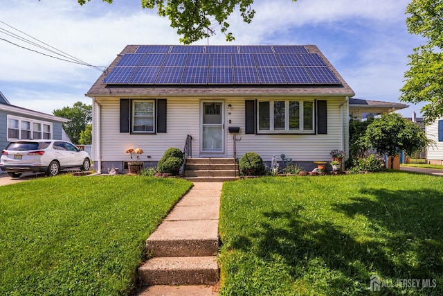 86 Lawrence St, Fords, NJ 08863 - view of front of home with roof mounted solar panels and a front yard