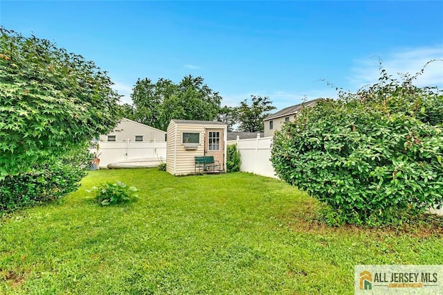 77 Navesink Ave, Middletown, NJ 07748 - fenced backyard featuring a storage unit