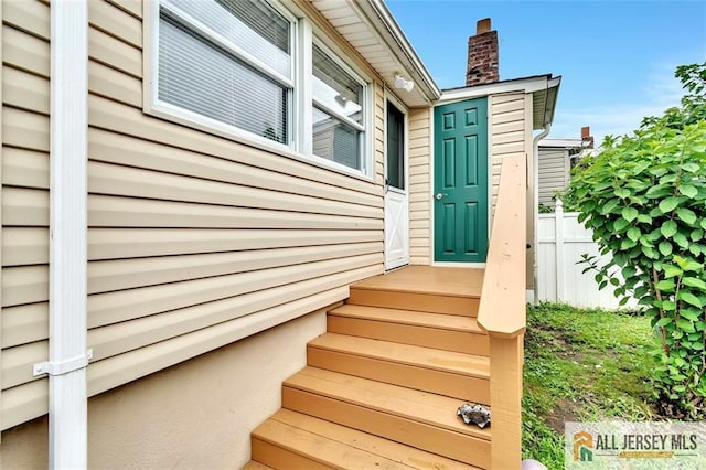 77 Navesink Ave, Middletown, NJ 07748 - view of exterior entry featuring a chimney