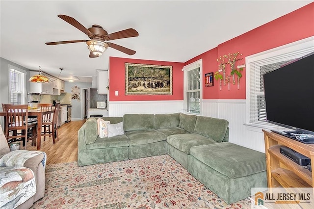 77 Navesink Ave, Middletown, NJ 07748 - living area featuring ceiling fan, light wood-type flooring, and wainscoting