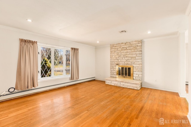 unfurnished living room with crown molding, a stone fireplace, light hardwood / wood-style flooring, and a baseboard heating unit