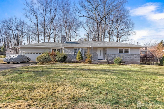 ranch-style home with a garage and a front yard