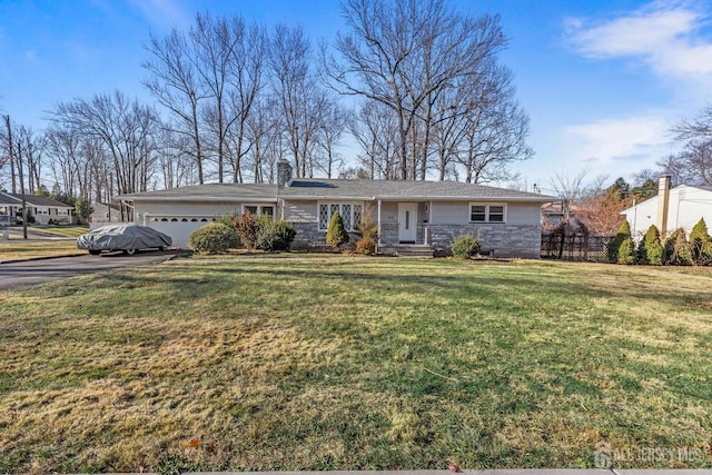 single story home with a garage and a front yard