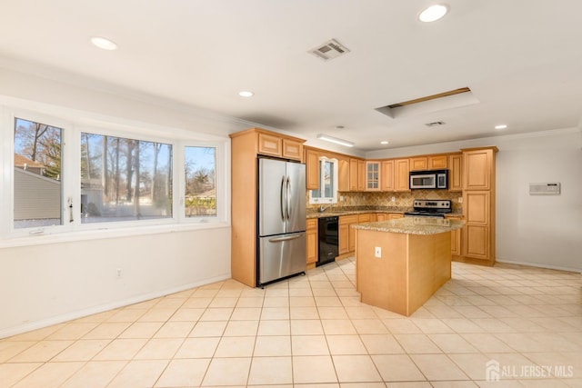 kitchen with a kitchen island, backsplash, light stone counters, stainless steel appliances, and crown molding