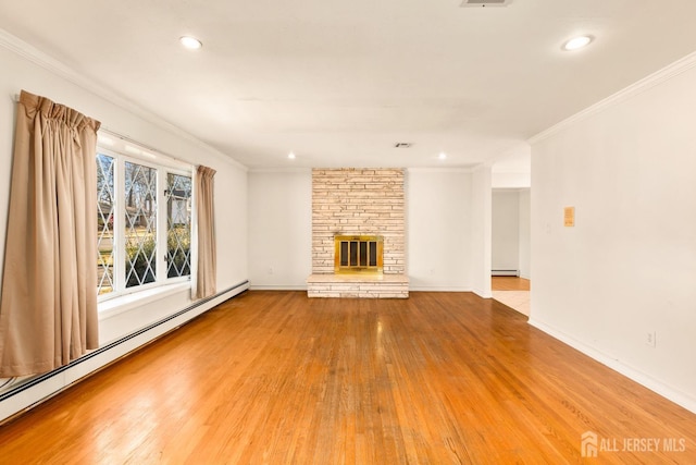 unfurnished living room featuring a baseboard radiator, ornamental molding, and a fireplace