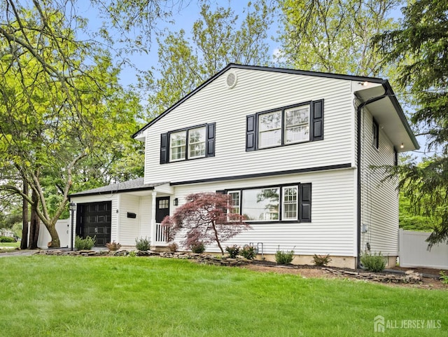 8 S Surrey Ln, East Brunswick, NJ 08816 - view of front facade with an attached garage and a front yard