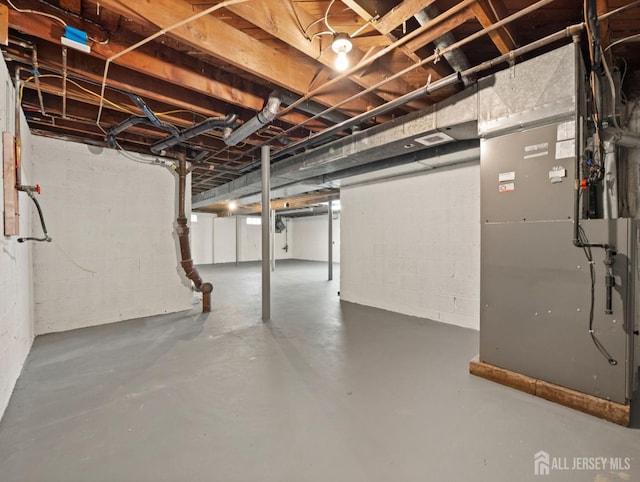 8 S Surrey Ln, East Brunswick, NJ 08816 - unfinished below grade area with heating unit and concrete block wall