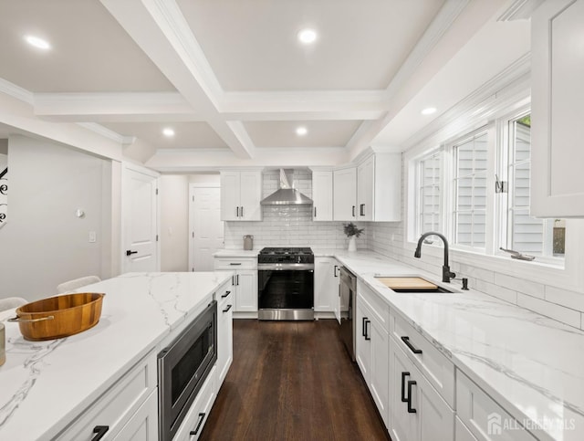 8 S Surrey Ln, East Brunswick, NJ 08816 - kitchen featuring stainless steel appliances, wall chimney exhaust hood, tasteful backsplash, white cabinets, and dark wood-type flooring