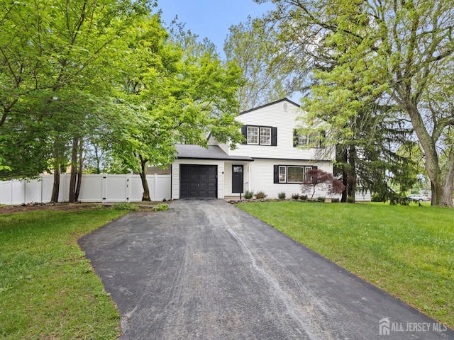8 S Surrey Ln, East Brunswick, NJ 08816 - view of front of property featuring asphalt driveway, a garage, and a gate