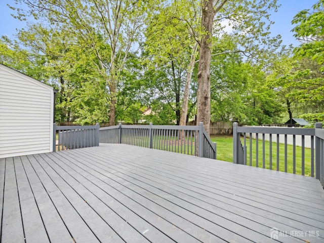 8 S Surrey Ln, East Brunswick, NJ 08816 - wooden terrace featuring a fenced backyard and view of scattered trees
