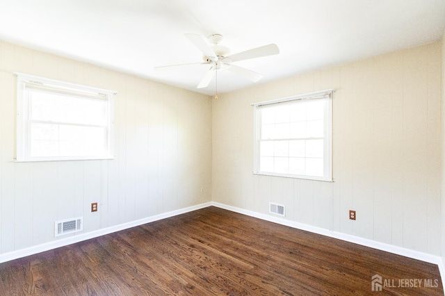 28 Beechwood Ave, Edison, NJ 08837 - unfurnished room with dark wood-style flooring, a ceiling fan, and baseboards