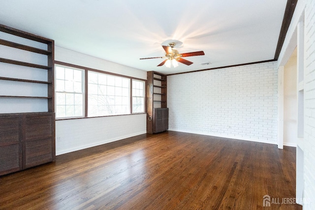 28 Beechwood Ave, Edison, NJ 08837 - spare room featuring brick wall, a ceiling fan, baseboards, dark wood-type flooring, and ornamental molding