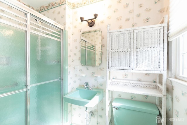 28 Beechwood Ave, Edison, NJ 08837 - full bath featuring wallpapered walls, toilet, a shower stall, and a sink