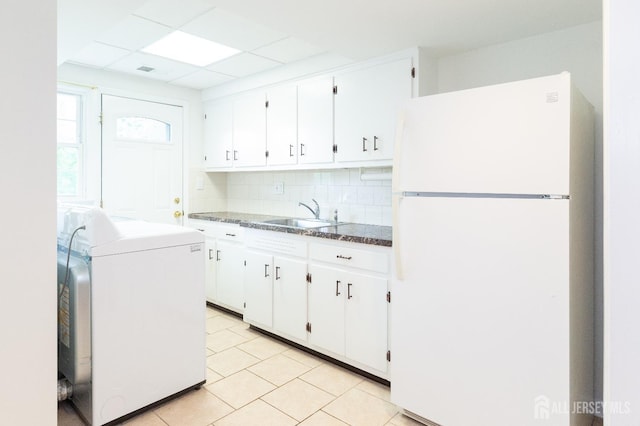 28 Beechwood Ave, Edison, NJ 08837 - kitchen with freestanding refrigerator, washer / clothes dryer, backsplash, and white cabinetry