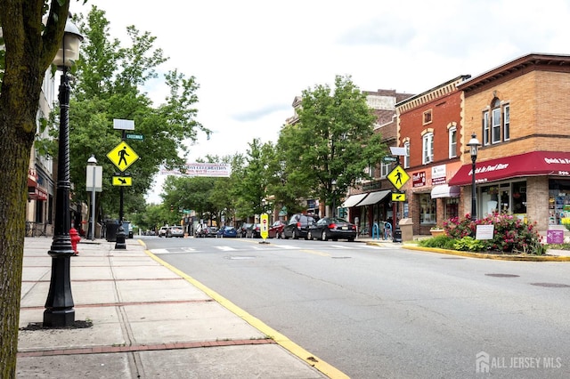 28 Beechwood Ave, Edison, NJ 08837 - view of asphalt street featuring street lights, traffic signs, curbs, and sidewalks