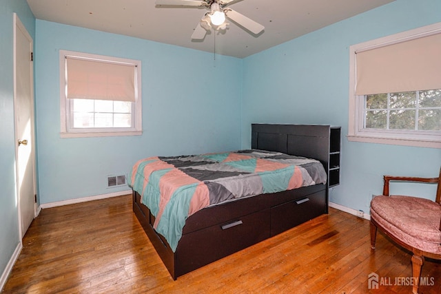 bedroom featuring ceiling fan and wood-type flooring