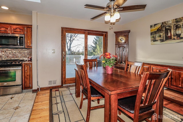 dining area featuring ceiling fan and light hardwood / wood-style floors