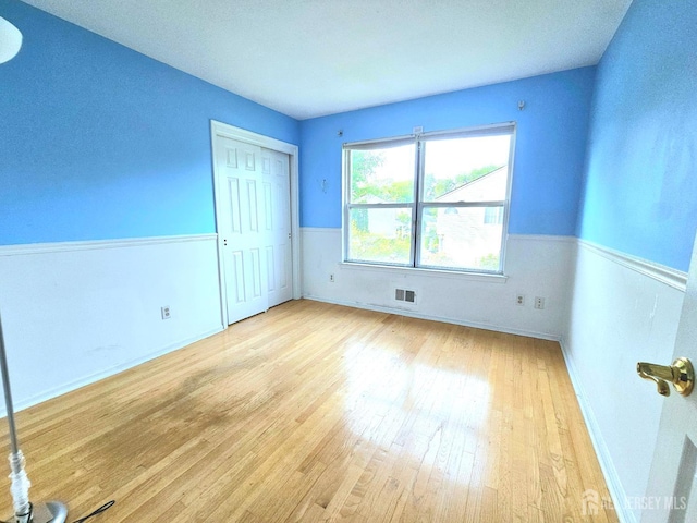 53 Perilli Dr, Hamilton, NJ 08610 - unfurnished bedroom with hardwood / wood-style flooring, a closet, and baseboards