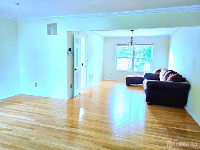 53 Perilli Dr, Hamilton, NJ 08610 - living area featuring crown molding, light wood-style flooring, a chandelier, and baseboards
