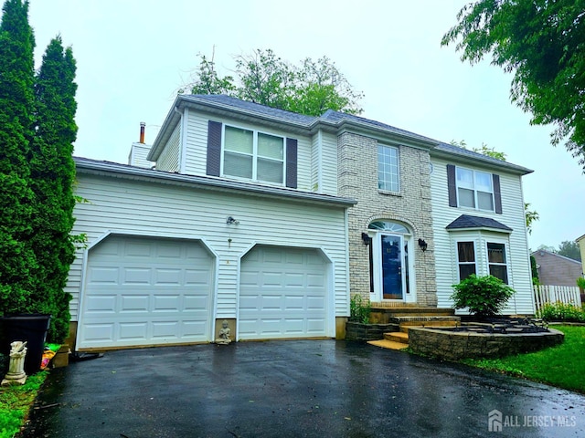 53 Perilli Dr, Hamilton, NJ 08610 - view of front of house with asphalt driveway, an attached garage, and a chimney