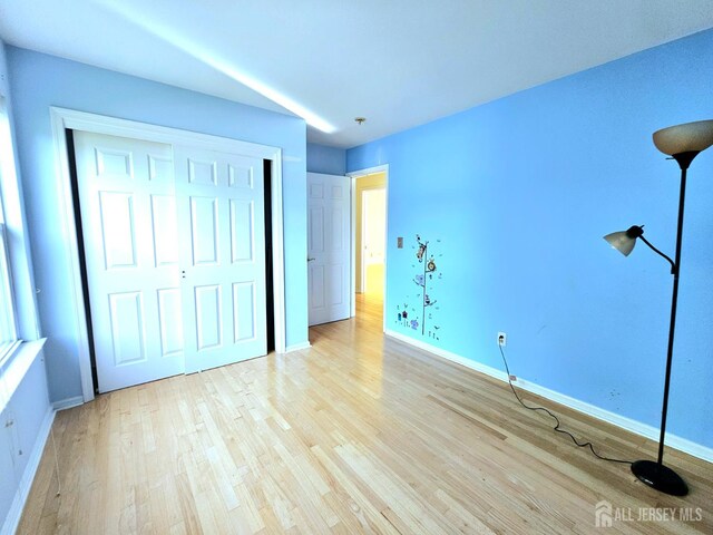 53 Perilli Dr, Hamilton, NJ 08610 - unfurnished bedroom featuring light wood-style floors, baseboards, and a closet