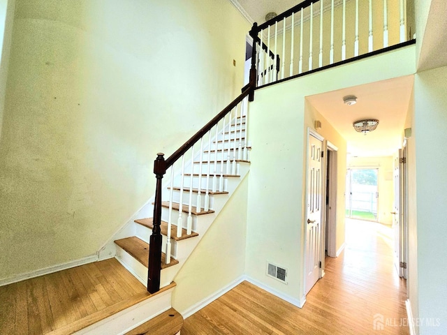 53 Perilli Dr, Hamilton, NJ 08610 - stairway featuring wood finished floors, baseboards, and a high ceiling