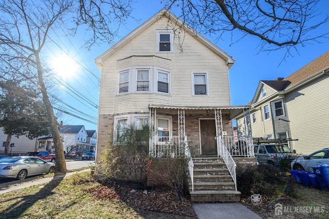 view of front of property featuring covered porch