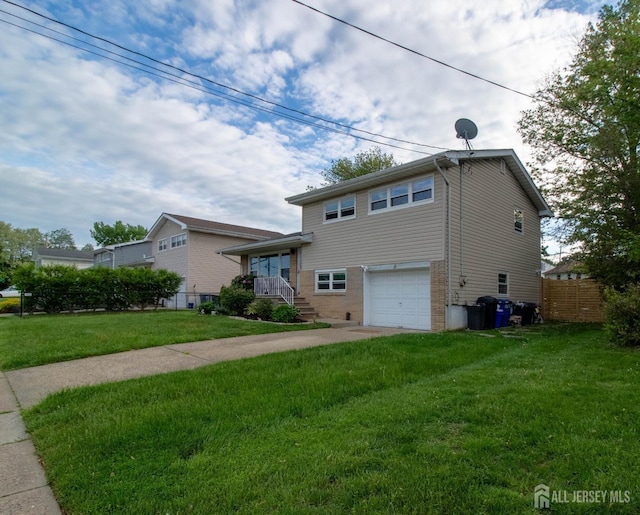 split level home featuring an attached garage, concrete driveway, and brick siding