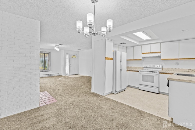 kitchen featuring white cabinets, pendant lighting, white appliances, and light carpet