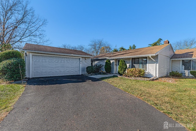 single story home with a front yard