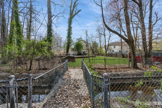 exterior space featuring a gate and fence