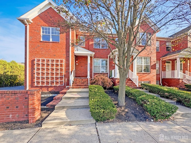 view of property with brick siding