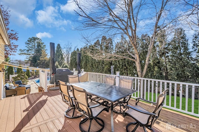 wooden terrace with outdoor dining area