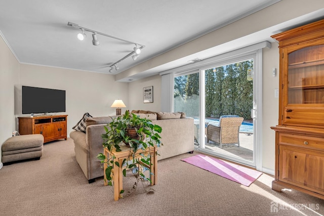 living area featuring light carpet and crown molding