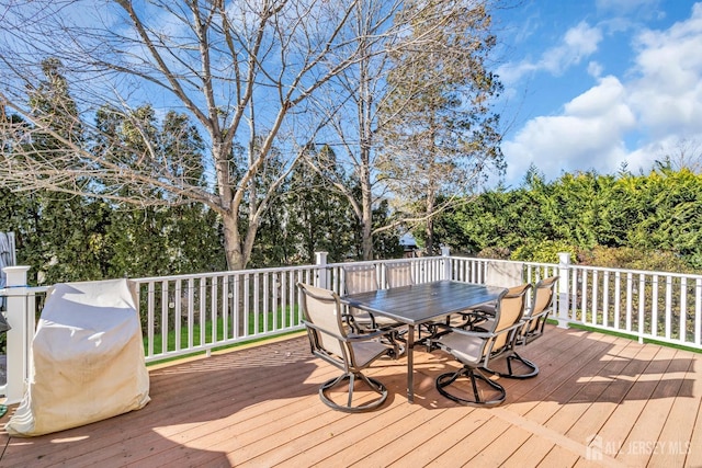 wooden deck with outdoor dining space