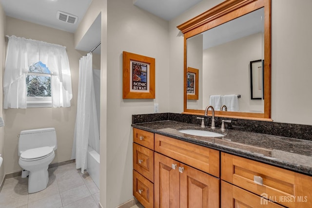 full bathroom with vanity, baseboards, visible vents, tile patterned flooring, and toilet