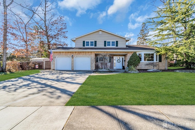 tri-level home featuring a front lawn, fence, concrete driveway, an attached garage, and a shingled roof