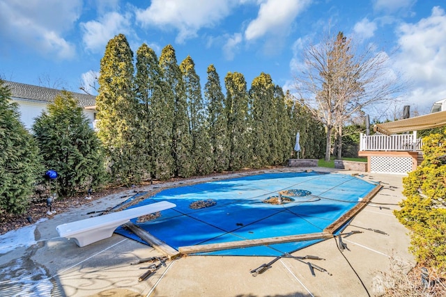 view of swimming pool featuring a patio area