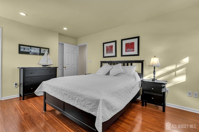 bedroom featuring recessed lighting, baseboards, and wood finished floors