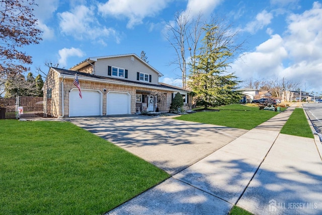 view of front of home featuring a front yard, fence, and driveway