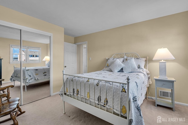 bedroom featuring a closet, visible vents, baseboards, and carpet floors