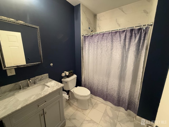 bathroom with vanity, toilet, and walk in shower