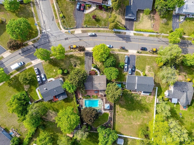 view of property location featuring nearby suburban area and a pool