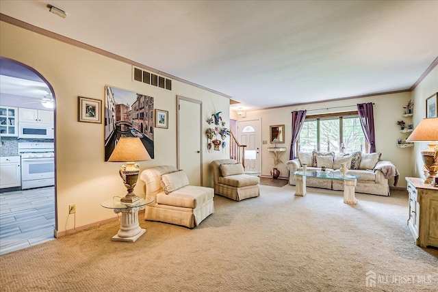 40 Hastings Rd, South Brunswick, NJ 08824 - living area featuring crown molding, carpet flooring, a ceiling fan, stairway, and arched walkways
