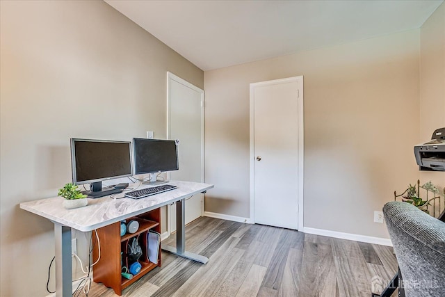 office featuring wood finished floors and baseboards