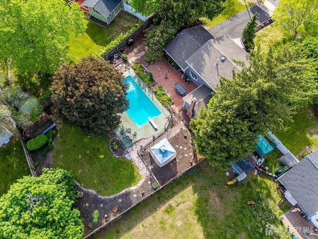 aerial view of property's location with a pool area