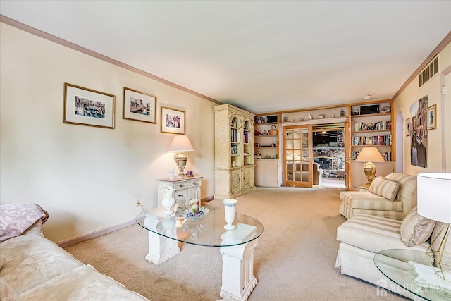 carpeted living room with crown molding
